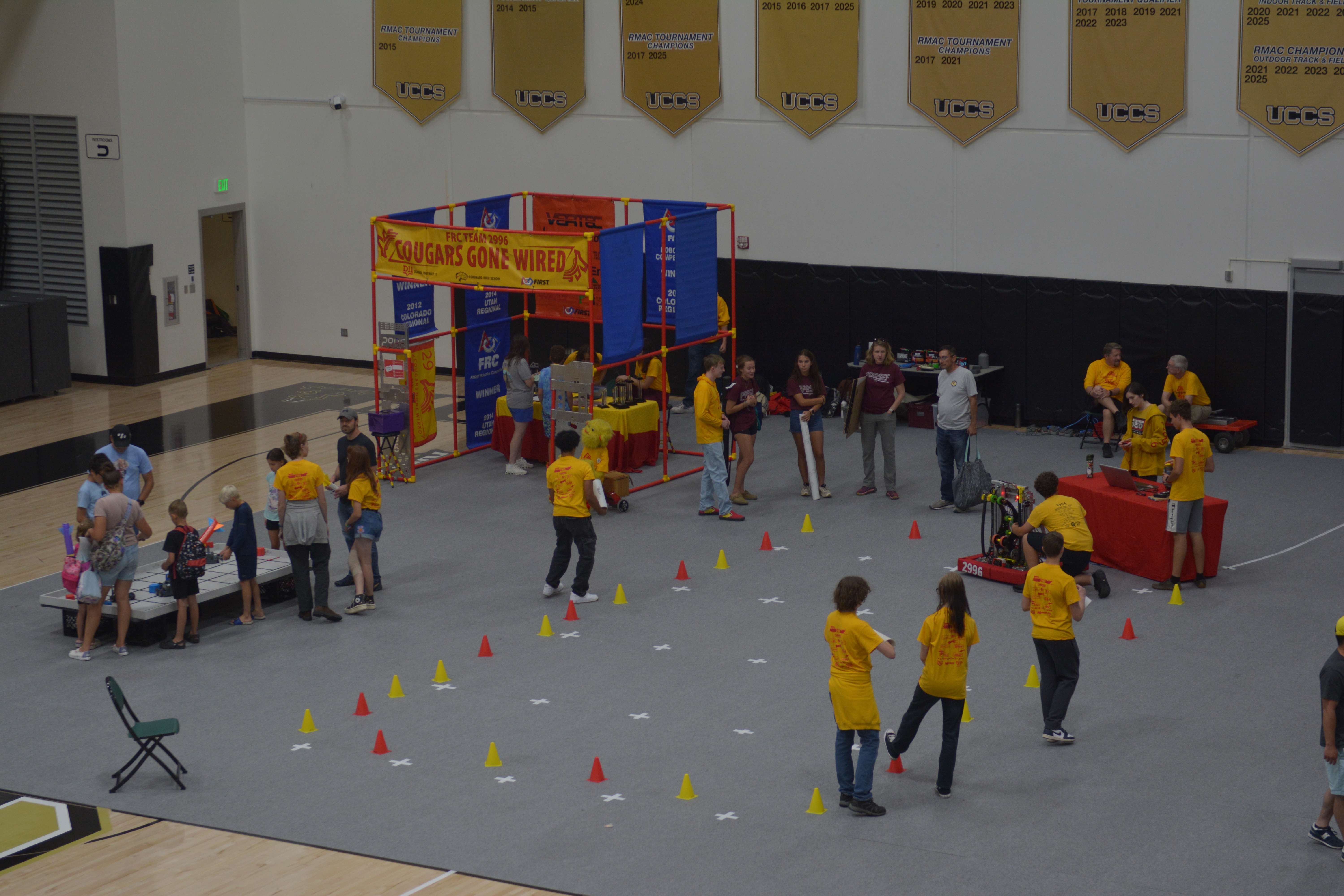 Photo of students working with children at the UCCS Cool Science event.